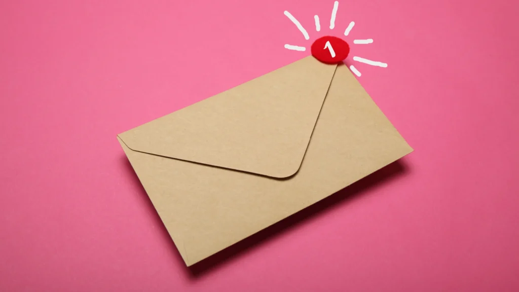 paper envelope with a notification on it to illustrate email marketing