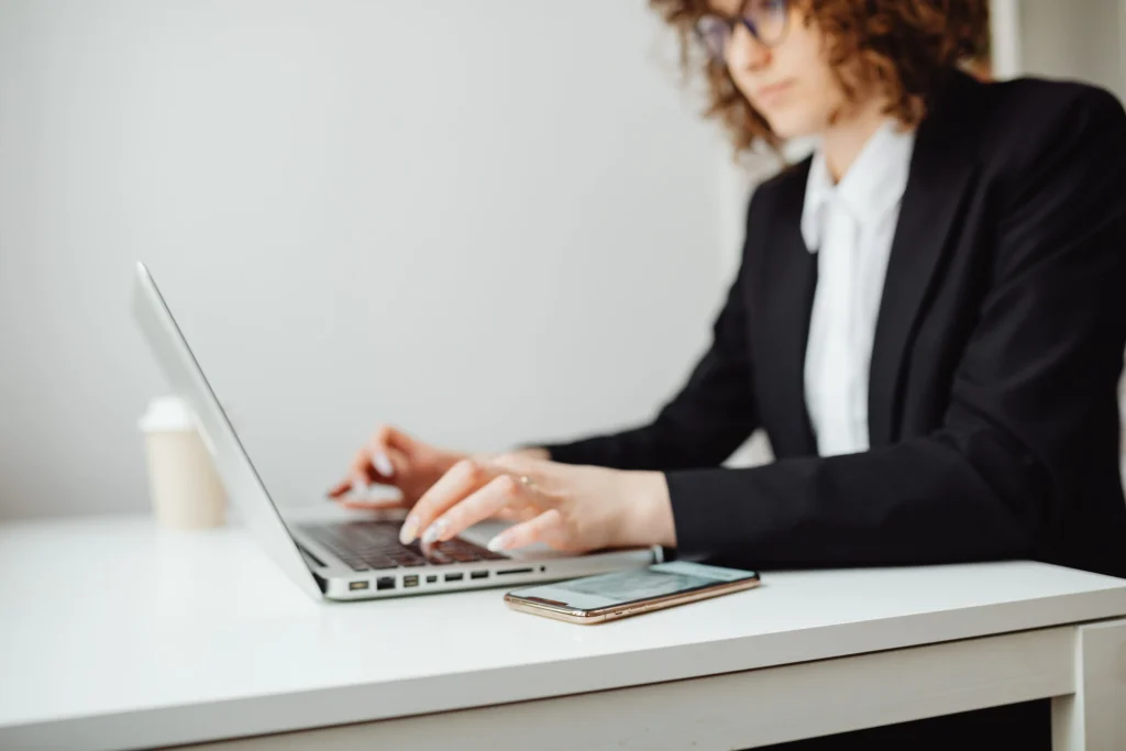 Lawyer typing on laptop side view